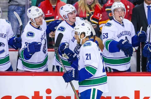 Oct 7, 2015; Calgary, Alberta, CAN; Vancouver Canucks center Brandon Sutter (21) celebrates his goal with teammates against the Calgary Flames during the first period at Scotiabank Saddledome. Mandatory Credit: Sergei Belski-USA TODAY Sports