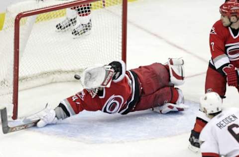 Carolina Hurricanes goalie John Grahame (47) lunges, but he can’t stop the game-winning shot by the Ottawa Senators’ Wade Redden (6) in the third period. The Senators defeated the Hurricanes, 4-2, at the RBC Center in Raleigh, North Carolina, Tuesday, February 27, 2007. (Photo by Chris Seward/Raleigh News & Observer/MCT via Getty Images)