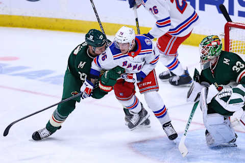 Mar 8, 2022; Saint Paul, Minnesota, USA; Minnesota Wild center Nick Bjugstad (27) hits New York Rangers center Jonny Brodzinski (76) during the third period at Xcel Energy Center. Mandatory Credit: Harrison Barden-USA TODAY Sports