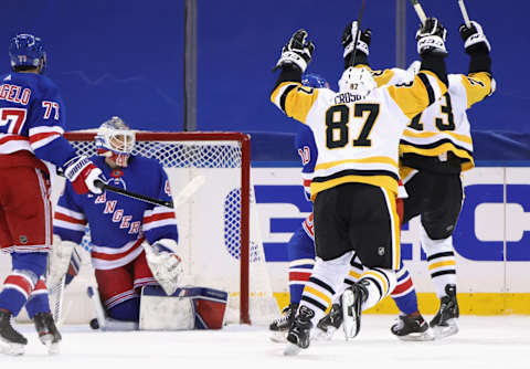 Sidney Crosby #87 of the Pittsburgh Penguins celebrates his game winning goal against Alexandar Georgiev #40 of the New York Rangers . Mandatory Credit: Bruce Bennett/POOL PHOTOS-USA TODAY Sports