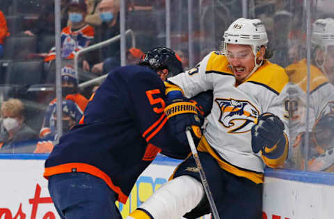 Edmonton Oilers Cody Ceci, #5, lays a body check. Mandatory Credit: Perry Nelson-USA TODAY Sports