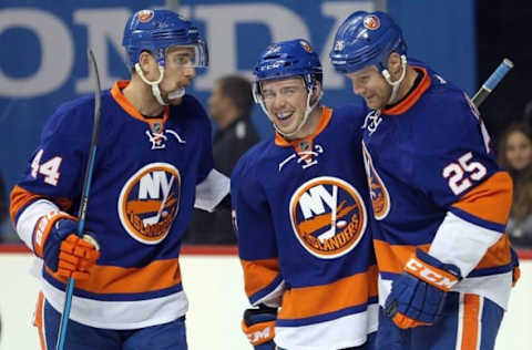 NHL Power Rankings: New York Islanders left wing Jason Chimera (25) celebrates his goal against the Pittsburgh Penguins with New York Islanders defenseman Calvin de Haan (44) and New York Islanders left wing Anthony Beauvillier (72) during the second period at Barclays Center. Mandatory Credit: Brad Penner-USA TODAY Sports