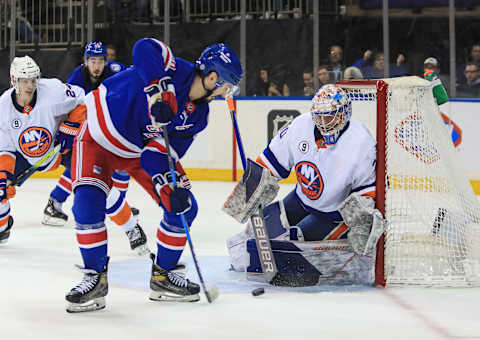 Mar 17, 2022; New York, New York, USA; New York Islanders goalie Ilya Sorokin (30) makes a save on New York Rangers left wing Chris Kreider (20) during the second period at Madison Square Garden. Mandatory Credit: Danny Wild-USA TODAY Sports