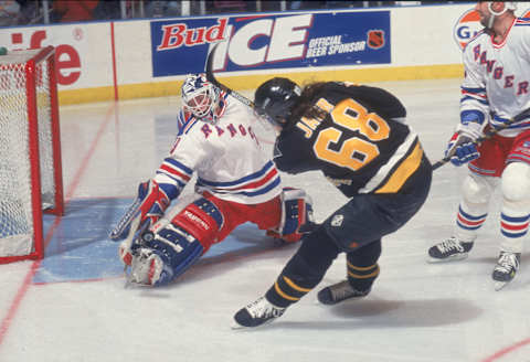 American hockey player Mike Richter, goalkeeper for the New York Rangers, stops a shot by Czech player Jaromir Jagr of the Pittsburgh Penguins during a game at Madison Square Garden, New York, New York, 1990s. (Photo by Bruce Bennett Studios/Getty Images)