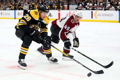 BOSTON, MASSACHUSETTS – DECEMBER 07: Samuel Girard #49 of the Colorado Avalanche defends Par Lindholm #26 of the Boston Bruins during the third period at TD Garden on December 07, 2019 in Boston, Massachusetts. The Avalanche defeat the Bruins 4-1. (Photo by Maddie Meyer/Getty Images)