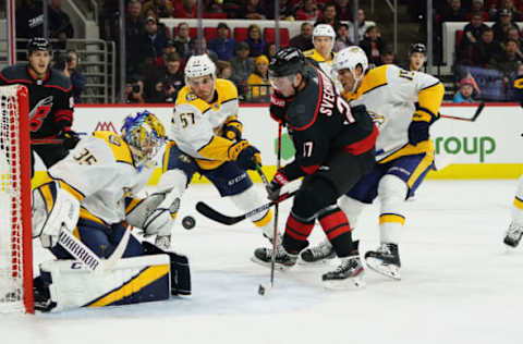 RALEIGH, NC – NOVEMBER 29: Andrei Svechnikov #37 of the Carolina Hurricanes looks to deflect the puck past Pekka Rinne #35 of the Nashville Predators during an NHL game on November 29, 2019 at PNC Arena in Raleigh, North Carolina. (Photo by Gregg Forwerck/NHLI via Getty Images)