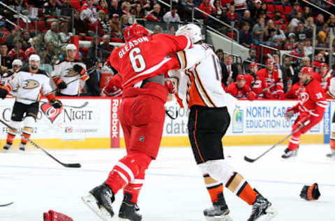 RALEIGH, NC – FEBRUARY 12: Tim Gleason #6 of the Carolina Hurricanes and Tim Jackman #18 of the Anaheim Ducks exchange punches during the second period on February 12, 2015. (Photo by Gregg Forwerck/NHLI via Getty Images)