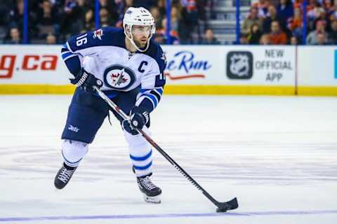 Feb 13, 2016; Edmonton, Alberta, CAN; Winnipeg Jets left wing Andrew Ladd (16) controls the puck against the Edmonton Oilers during the shoot out period at Rexall Place. Winnipeg Jets won 2-1. Mandatory Credit: Sergei Belski-USA TODAY Sports