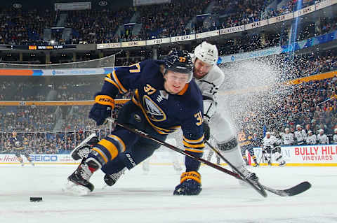 BUFFALO, NY – DECEMBER 11: Casey Mittelstadt #37 of the Buffalo Sabres and Derek Forbort #24 of the Los Angeles Kings battle for the puck during an NHL game on December 11, 2018 at KeyBank Center in Buffalo, New York. (Photo by Bill Wippert/NHLI via Getty Images)