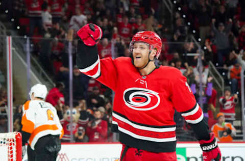 Jan 7, 2020; Raleigh, North Carolina, USA; Carolina Hurricanes defenseman Dougie Hamilton (19) reacts after scoring the game winning goal in the over time against the Philadelphia Flyers at PNC Arena. The Carolina Hurricanes defeated the Philadelphia Flyers 5-4 in the over time. Mandatory Credit: James Guillory-USA TODAY Sports