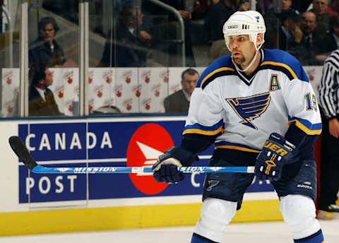 TORONTO – DECEMBER 9: Scott Mellanby #19 of the St. Louis Blues eyes the play against the Toronto Maple Leafs at Air Canada Centre on December 9, 2003 in Toronto, Ontario. The Blues defeated the Maple Leafs in overtime 3-2. (Photo By Dave Sandford/Getty Images)