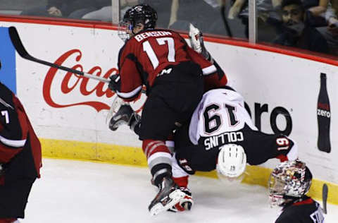 Tyler Benson #17 of the Vancouver Giants checks Shane Collins #19 of the Prince George Cougars into the boards during the first period of their WHL game at the Pacific Coliseum on October 25, 2015 in Vancouver, British Columbia, Canada.Oct. 24, 2015 – Source: Ben Nelms/Getty Images North America