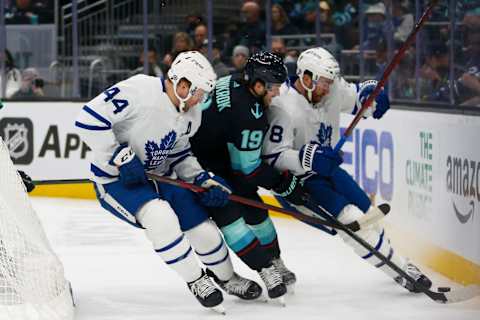 Feb 14, 2022; Seattle, Washington, USA; Toronto Maple Leafs defenseman Morgan Rielly (44) and defenseman TJ Brodie (78) pursue the puck against Seattle Kraken center Calle Jarnkrok (19) during the first period at Climate Pledge Arena. Mandatory Credit: Joe Nicholson-USA TODAY Sports