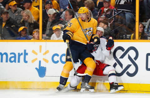 NASHVILLE, TN – APRIL 7: Alexei Emelin #25 of the Nashville Predators checks Brandon Dubinsky #17 of the Columbus Blue Jackets during an NHL game at Bridgestone Arena on April 7, 2018 in Nashville, Tennessee. (Photo by John Russell/NHLI via Getty Images)