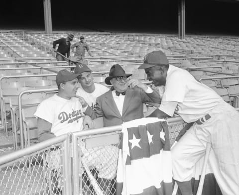 (Original Caption) The Dodgers at Yankee Stadium are shown with left to right Gil Hodges, Gene Hermanski, Branch Rickey, and Jackie Robinson, during the World Series.