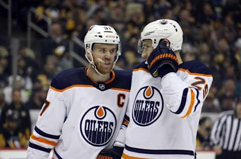 Apr 26, 2022; Pittsburgh, Pennsylvania, USA; Edmonton Oilers center Connor McDavid (97) and center Leon Draisaitl (29) talk prior to a face-off against the Pittsburgh Penguins during the first period at PPG Paints Arena. Mandatory Credit: Charles LeClaire-USA TODAY Sports