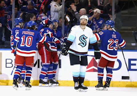 NEW YORK, NEW YORK – FEBRUARY 10: Adam Larsson #6 of the Seattle Kraken looks at the scoreboard as the New York Rangers celebrate a third period goal by Mika Zibanejad #93 at Madison Square Garden on February 10, 2023 in New York City. The Rangers defeated the Kraken 6-3. (Photo by Bruce Bennett/Getty Images)