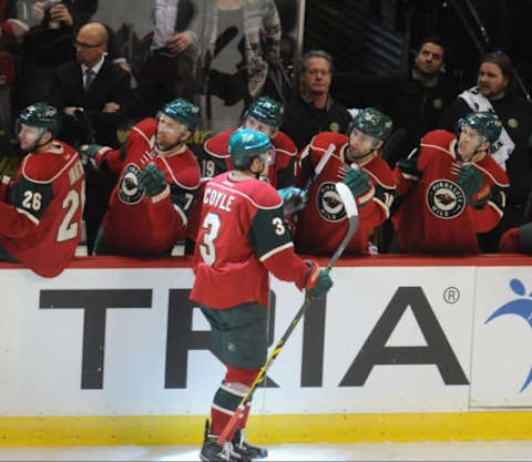 Jan 25, 2016; Saint Paul, MN, USA; Minnesota Wild center Charlie Coyle (3) celebrates his goal with the team during the third period against the Arizona Coyotes at Xcel Energy Center. The Coyotes win 2-1 in an overtime shootout. Mandatory Credit: Marilyn Indahl-USA TODAY Sports