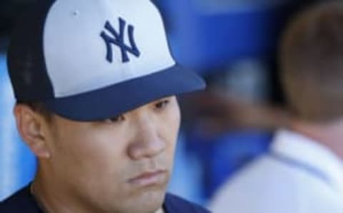 Mar 6, 2016; Clearwater, FL, USA; New York Yankees starting pitcher Masahiro Tanaka (19) talks in the dugout after the second inning against the Philadelphia Phillies at Bright House Field. Mandatory Credit: Kim Klement-USA TODAY Sports