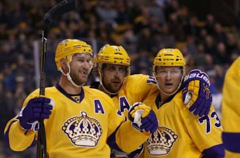 NHL Line Combinations: Los Angeles Kings center Jeff Carter (77) celebrates with center Anze Kopitar (11) and right wing Tyler Toffoli (73) after scoring a goal against the Boston Bruins during the first period at TD Garden. Mandatory Credit: Greg M. Cooper-USA TODAY Sports