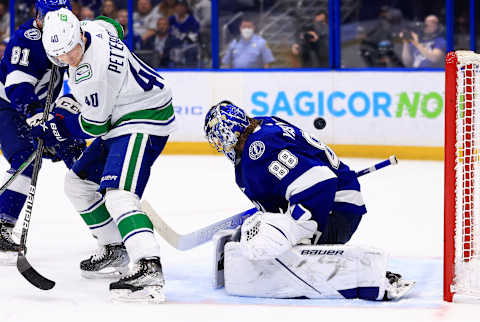 TAMPA, FLORIDA – JANUARY 13: Andrei Vasilevskiy #88 of the Tampa Bay Lightning makes a save during a game against the Vancouver Canucks at Amalie Arena on January 13, 2022 in Tampa, Florida. (Photo by Mike Ehrmann/Getty Images)