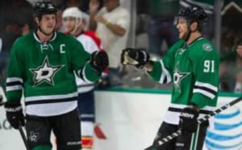 Sep 29, 2014; Dallas, TX, USA; Dallas Stars center Tyler Seguin (91) and left wing Jamie Benn (14) celebrate Seguins third goal against the Florida Panthers during the third period at the American Airlines Center. Seguin has a hat trick in the game. The Stars defeated the Panthers 5-4. Mandatory Credit: Jerome Miron-USA TODAY Sports