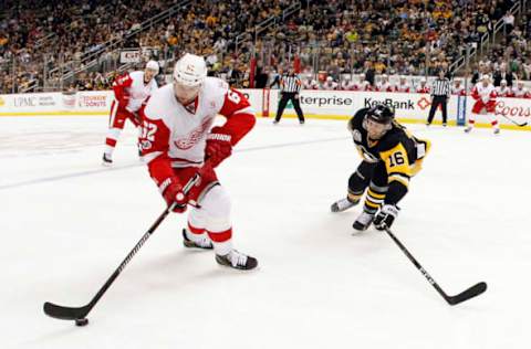 Feb 19, 2017; Pittsburgh, PA, USA; Detroit Red Wings left wing Thomas Vanek (62) skates with the puck as Pittsburgh Penguins center Eric Fehr (16) defends during the second period at the PPG PAINTS Arena. The Red Wings won 5-2. Mandatory Credit: Charles LeClaire-USA TODAY Sports