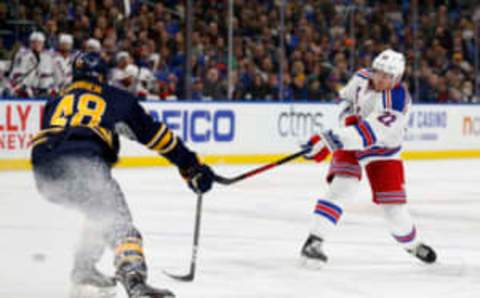 Feb 2, 2017; Buffalo, NY, USA; Buffalo Sabres left wing William Carrier (48) tries to block a shot by New York Rangers defenseman Nick Holden (22) (Timothy T. Ludwig-USA TODAY Sports)