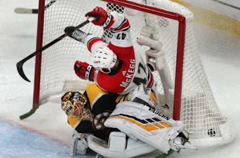 BOSTON – MAY 9: Carolina Hurricanes’ Greg McKegg (42) collides into Bruins goalie Tuukka Rask after scoring a second period goal against him. The Boston Bruins host the Carolina Hurricanes in Game 1 of the NHL Eastern Conference Finals on May 9, 2019. (Photo by John Tlumacki/The Boston Globe via Getty Images)