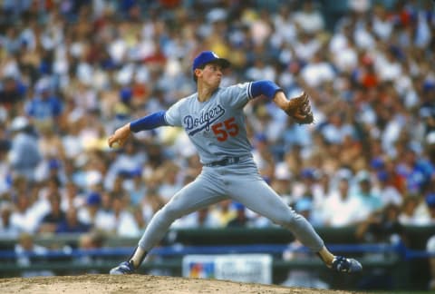 CHICAGO, IL – CIRCA 1988: Orel Hershiser #55 of the Los Angeles Dodgers pitches against the Chicago Cubs during an Major League Baseball game circa 1988 at Wrigley Field in Chicago, Illinois. Hershiser played for the Dodgers from 1983-94 and in 2000. (Photo by Focus on Sport/Getty Images)