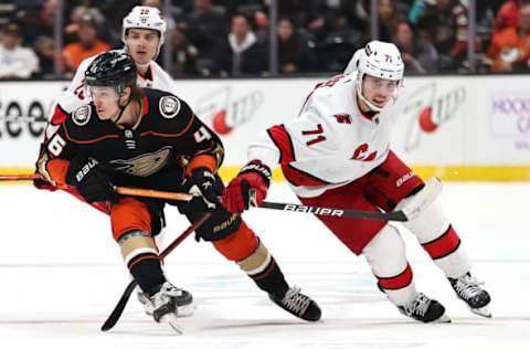 ANAHEIM, CALIFORNIA – NOVEMBER 18: Trevor Zegras #46 of the Anaheim Ducks skates away from Jesper Fast #71 of the Carolina Hurricanes during the third period of a game at Honda Center on November 18, 2021, in Anaheim, California. (Photo by Sean M. Haffey/Getty Images)