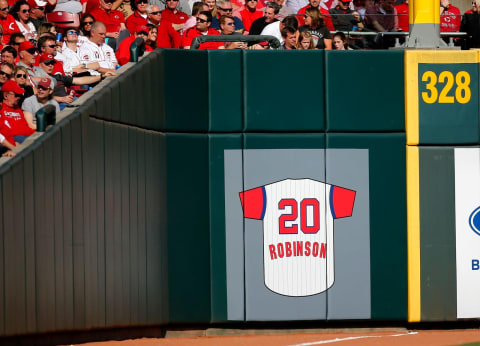 A commutative No. 20 Frank Robinson jersey is added down the left field line as seen in the fourth inning of the Opening Day game between the Cincinnati Reds and the Pittsburgh Pirates at Great American Ball Park in downtown Cincinnati on Thursday, March 28, 2019.Cincinnati Reds Opening Day