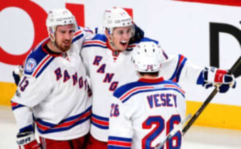 Apr 20, 2017; Montreal, Quebec, CAN; New York Rangers defenseman Brady Skjei (76) celebrates his goal against Montreal Canadiens with teammates left wing Jimmy Vesey (26) and right wing Kevin Hayes (13) during the second period in game five of the first round of the 2017 Stanley Cup Playoffs at Bell Centre. Mandatory Credit: Jean-Yves Ahern-USA TODAY Sports