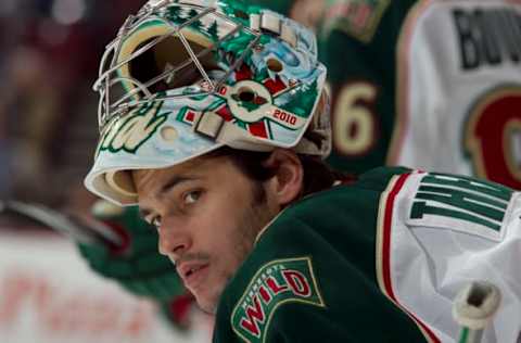 VANCOUVER, CANADA – MARCH 14: Jose Theodore #60 of the Minnesota Wild looks at the Vancouver Canucks’ bench in the game between the Minnesota Wild and the Vancouver Canucks at Rogers Arena on March 14, 2011 in Vancouver, British Columbia, Canada. (Photo by Jeff Vinnick/NHLI via Getty Images)