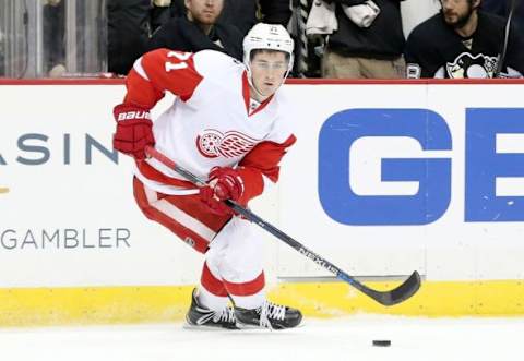 Feb 18, 2016; Pittsburgh, PA, USA; Detroit Red Wings center Dylan Larkin (71) skates with the puck against the Pittsburgh Penguins during the third period at the CONSOL Energy Center. The Penguins won 6-3. Mandatory Credit: Charles LeClaire-USA TODAY Sports