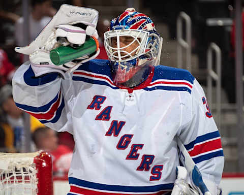 DETROIT, MI – FEBRUARY 1: Goaltender Henrik Lundqvist #30 of the New York Rangers squirts water onto his face during a stoppage in play in an NHL game against the Detroit Red Wings at Little Caesars Arena on February 1, 2020 in Detroit, Michigan. (Photo by Dave Sandford/NHLI via Getty Images)