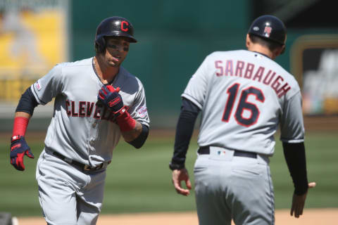 May 11, 2019; Oakland, CA, USA; Cleveland Indians center fielder Leonys Martin (2) receives congratulations from third base coach Mike Sarbaugh (16) after hitting a home run during the fifth inning against the Oakland Athletics at Oakland Coliseum. Mandatory Credit: Darren Yamashita-USA TODAY Sports