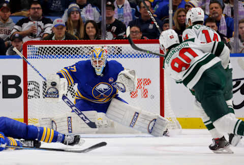 Nov 10, 2023; Buffalo, New York, USA; Buffalo Sabres goaltender Devon Levi (27) makes a blocker save on Minnesota Wild left wing Marcus Johansson (90) during the second period at KeyBank Center. Mandatory Credit: Timothy T. Ludwig-USA TODAY Sports