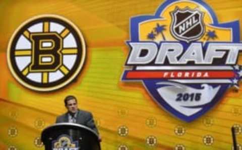 Jun 26, 2015; Sunrise, FL, USA; Boston Bruins general manager Don Sweeney makes the first of three consecutive draft picks in the first round of the 2015 NHL Draft at BB&T Center. Mandatory Credit: Steve Mitchell-USA TODAY Sports