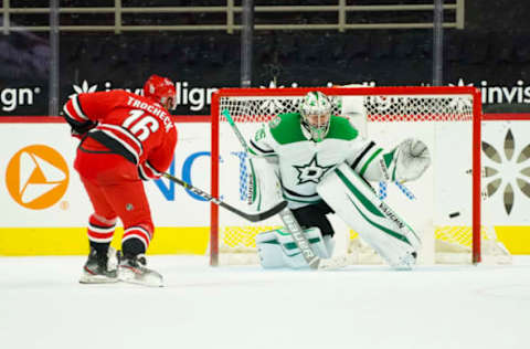 Jan 31, 2021; Raleigh, North Carolina, USA; Carolina Hurricanes center Vincent Trocheck (16) scores the game winning shootout goal against Dallas Stars goaltender Anton Khudobin (35) at PNC Arena. Mandatory Credit: James Guillory-USA TODAY Sports