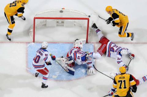 PITTSBURGH, PA – FEBRUARY 17: Alexandar Georgiev #40 of the New York Rangers protects the net against Sidney Crosby #87 of the Pittsburgh Penguins, Patric Hornqvist #72 of the Pittsburgh Penguins, Evgeni Malkin #71 of the Pittsburgh Penguins at PPG Paints Arena on February 17, 2019 in Pittsburgh, Pennsylvania. (Photo by Joe Sargent/NHLI via Getty Images)