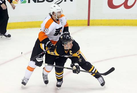 Apr 1, 2015; Pittsburgh, PA, USA; Philadelphia Flyers center Claude Giroux (28) checks Pittsburgh Penguins center Sidney Crosby (87) during the second period at the CONSOL Energy Center. Mandatory Credit: Charles LeClaire-USA TODAY Sports