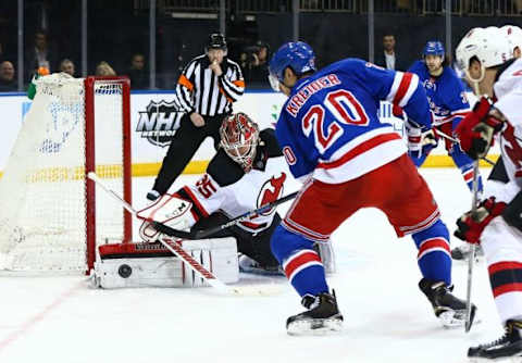 Feb 8, 2016; New York, NY, USA; New Jersey Devils goaltender Cory Schneider (35) makes a pad save on a close in shot by New York Rangers left wing Chris Kreider (20) during the second period at Madison Square Garden. Mandatory Credit: Andy Marlin-USA TODAY Sports