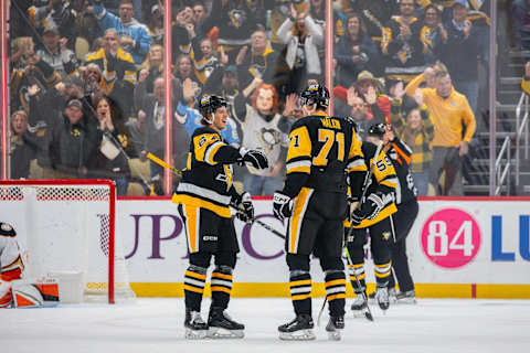 PITTSBURGH, PENNSYLVANIA – OCTOBER 30: Rickard Rakell #67 and Evgeni Malkin #71 of the Pittsburgh Penguins during the game against the Anaheim Ducks at PPG PAINTS Arena on October 30, 2023 in Pittsburgh, Pennsylvania. (Photo by Harrison Barden/Getty Images)