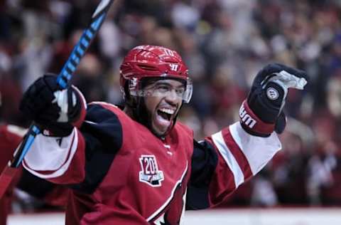 Nov 1, 2016; Glendale, AZ, USA; Arizona Coyotes left wing Anthony Duclair (10) celebrates a goal by left wing Jamie McGinn (88) during the second period against San Jose Sharks at Gila River Arena. Mandatory Credit: Matt Kartozian-USA TODAY Sports