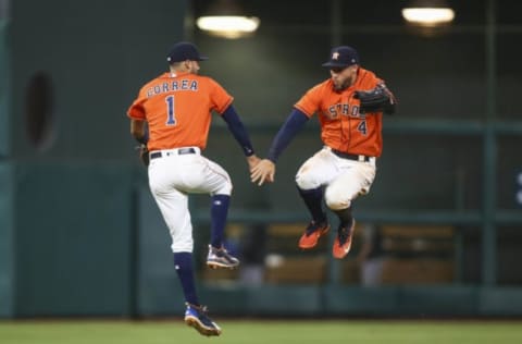 May 26, 2017; Houston, TX, USA; Houston Astros shortstop Carlos Correa (1) and right fielder George Springer (4) celebrate after the Astros defeated the Baltimore Orioles at Minute Maid Park. Mandatory Credit: Troy Taormina-USA TODAY Sports