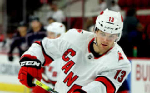 RALEIGH, NC – OCTOBER 12: Warren Foegele #13 of the Carolina Hurricanes shoots the puck during warm ups prior to an NHL game against the Columbus Blue Jackets on October 12, 2019 at PNC Arena in Raleigh North Carolina. (Photo by Gregg Forwerck/NHLI via Getty Images)