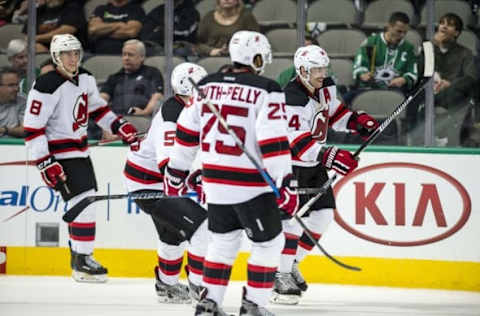 Nov 15, 2016; Dallas, TX, USA; New Jersey Devils center Adam Henrique (14) celebrates scoring the game winning goal against Dallas Stars goalie Antti Niemi (not pictured) during the overtime period at the American Airlines Center. The Devils defeated the Stars 2-1 in overtime. Mandatory Credit: Jerome Miron-USA TODAY Sports