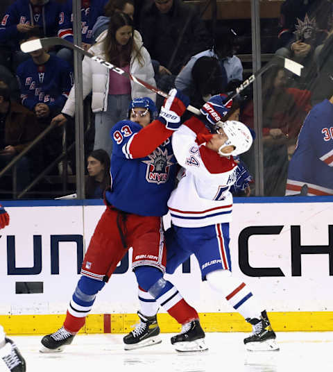 NEW YORK, NEW YORK – JANUARY 15: Mika Zibanejad #93 of the New York Rangers tangles with Jordan Harris #54 of the Montreal Canadiens at Madison Square Garden on January 15, 2023 in New York City. The Canadiens defeated the Rangers 2-1. (Photo by Bruce Bennett/Getty Images)