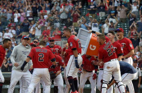 MINNEAPOLIS, MN – JULY 15: The Minnesota Twins celebrate as Brian Dozier #2 of the Minnesota Twins crosses home plate after a walk-off grand slam against the Tampa Bay Rays during the tenth inning of the game on July 15, 2018 at Target Field in Minneapolis, Minnesota. The Twins defeated the Rays 11-7 in ten innings. (Photo by Hannah Foslien/Getty Images)